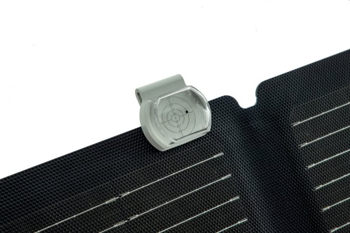 Solar panel with micro-inverter, close-up shot highlighting efficiency and design, suitable for renewable energy solutions and portable solar power systems.