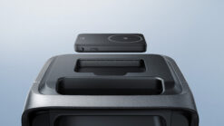 Compact portable power bank with wireless charging pad on top, designed for outdoor and emergency use. Ideal for charging smartphones and small electronics, featuring a sleek black finish.